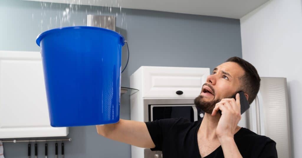 Professionals repairing water-damaged ceiling in Utah home