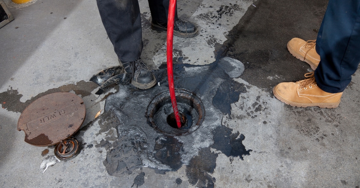Professional team fixing a backed-up sewer line in Utah