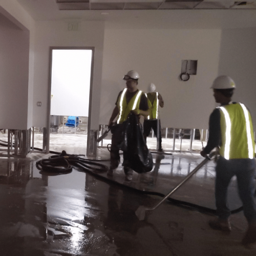 The Flood Company restoration team posing at a commercial site